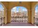 Balcony with decorative railings and arched windows, offering city and street views at 2855 Peachtree Ne Rd # 302, Atlanta, GA 30305