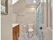 Bathroom featuring marble floors, a toilet, shower curtain, and fixtures at 2855 Peachtree Ne Rd # 302, Atlanta, GA 30305
