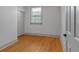 Bedroom with wood floors, a double door closet, neutral paint and natural light at 2855 Peachtree Ne Rd # 302, Atlanta, GA 30305