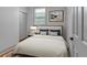 Bedroom with soft lighting, a comfortable bed, and neutral decor for a relaxing atmosphere at 2855 Peachtree Ne Rd # 302, Atlanta, GA 30305