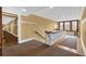 Interior hallway with tan walls, carpet, and staircase provides access to building amenities at 2855 Peachtree Ne Rd # 302, Atlanta, GA 30305