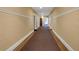 Neutral hallway with tan walls and carpet creates a quiet, comfortable living space at 2855 Peachtree Ne Rd # 302, Atlanta, GA 30305