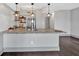 Modern kitchen with stainless steel appliances, granite countertops, and elegant pendant lighting at 2855 Peachtree Ne Rd # 302, Atlanta, GA 30305