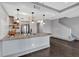 Open kitchen features granite countertops, stainless appliances, and stylish pendant lighting at 2855 Peachtree Ne Rd # 302, Atlanta, GA 30305