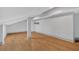 Open concept living room featuring hardwood floors, neutral gray walls, and modern recessed lighting at 2855 Peachtree Ne Rd # 302, Atlanta, GA 30305