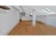 Open concept living room featuring hardwood floors, neutral gray walls and natural light from sky light at 2855 Peachtree Ne Rd # 302, Atlanta, GA 30305