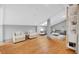 Bright living room featuring hardwood floors, comfortable seating, and a stylish modern aesthetic at 2855 Peachtree Ne Rd # 302, Atlanta, GA 30305