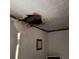 Damaged ceiling showing a large hole with exposed framing and water damage at 1092 Victory Dr, Atlanta, GA 30310