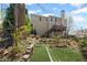 Back exterior with a multi-level deck, steps leading to the yard, and mature trees at 1760 Clayton Cir, Cumming, GA 30040