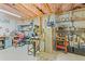 Unfinished basement area with exposed ceiling, shelving, and workbench at 1760 Clayton Cir, Cumming, GA 30040