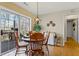 Cozy dining area features a round table, wood floors, and a sliding glass door to the outdoor deck at 1760 Clayton Cir, Cumming, GA 30040