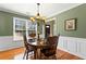 Traditional dining room with hardwood floors and a large bright window at 1760 Clayton Cir, Cumming, GA 30040