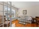 Cozy sitting room with hardwood floors, bright window, and comfortable seating at 1760 Clayton Cir, Cumming, GA 30040