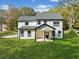 Charming two-story home with a inviting front porch and lush green lawn at 2788 Browns Mill Se Rd, Atlanta, GA 30354