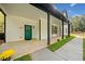 Charming front porch with a bright teal door and black accents at 2788 Browns Mill Se Rd, Atlanta, GA 30354