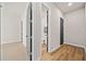 Hallway with gray doors and wood and carpet floors at 2788 Browns Mill Se Rd, Atlanta, GA 30354