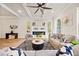 Cozy living room with wood beams, a fireplace, and lots of natural light at 2788 Browns Mill Se Rd, Atlanta, GA 30354