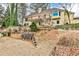 Backyard with lake views, tiered landscaping, and wood retaining walls at 573 Ripplewater Sw Dr, Marietta, GA 30064