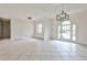 Elegant foyer with tile flooring, large windows, and a modern light fixture at 573 Ripplewater Sw Dr, Marietta, GA 30064