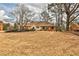 Charming single-story home with a brick facade, yellow trim, and well-manicured lawn at 573 Ripplewater Sw Dr, Marietta, GA 30064