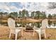 Lakeside view with lawn chairs surrounding a fire pit at 573 Ripplewater Sw Dr, Marietta, GA 30064