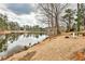 Scenic view of the lake and firepit on the property at 573 Ripplewater Sw Dr, Marietta, GA 30064