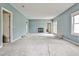 Cozy living room featuring a fireplace, neutral carpet, and nice blue walls at 573 Ripplewater Sw Dr, Marietta, GA 30064