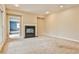 Spacious living room featuring a fireplace and neutral carpet at 573 Ripplewater Sw Dr, Marietta, GA 30064