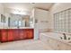 Elegant bathroom with double sinks, soaking tub, natural light and vanity with storage at 573 Ripplewater Sw Dr, Marietta, GA 30064