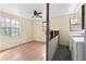 Bedroom including hardwood floors, and natural light from windows at 6219 Holly Ann Se St, Acworth, GA 30102