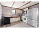 Kitchen featuring stainless steel appliances and wood-look floors at 6219 Holly Ann Se St, Acworth, GA 30102