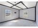 Spacious room with modern windows and neutral walls at 6219 Holly Ann Se St, Acworth, GA 30102