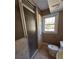 Bathroom featuring a glass shower and bright window at 6470 Wright Cir, Atlanta, GA 30328