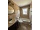 Bathroom with stone tile features, an ornate mirror, and a combined shower-tub at 6470 Wright Cir, Atlanta, GA 30328