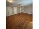 Bright bedroom with hardwood floors, a ceiling fan, and ample closet space at 6470 Wright Cir, Atlanta, GA 30328