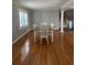 Dining area featuring hardwood floors, natural light, and a dining table with seating for six at 6470 Wright Cir, Atlanta, GA 30328