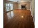 Well-lit living room with hardwood floors and a cozy fireplace at 6470 Wright Cir, Atlanta, GA 30328