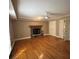 Spacious living room featuring a fireplace and beautiful hardwood floors at 6470 Wright Cir, Atlanta, GA 30328