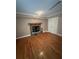 Comfortable living area with hardwood floors and a fireplace at 6470 Wright Cir, Atlanta, GA 30328