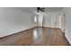 This bedroom features hardwood floors, one window with shutters, a ceiling fan and closet at 1643 North Springs Dr, Dunwoody, GA 30338