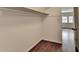 Walk in closet featuring hardwood floors and a view to a window at 1643 North Springs Dr, Dunwoody, GA 30338