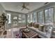 Bright sunroom with neutral-toned furniture and lots of natural lighting at 1643 North Springs Dr, Dunwoody, GA 30338