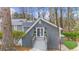 Exterior view of back building with white french doors and steps leading to building entrance at 4655 Jett Rd, Atlanta, GA 30327