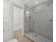 Sleek bathroom with a large glass-enclosed shower featuring marble tile at 4655 Jett Rd, Atlanta, GA 30327