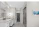 Bathroom featuring a long vanity with white cabinets and countertop and a glass door shower on the right at 4655 Jett Rd, Atlanta, GA 30327