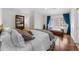 Bright bedroom with hardwood floors, and comfortable seating by the window at 4655 Jett Rd, Atlanta, GA 30327