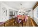 Dining room with hardwood floors, chandelier lighting, and open layout at 4655 Jett Rd, Atlanta, GA 30327