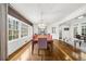 Spacious dining room with chandelier, hardwood floors, and large windows at 4655 Jett Rd, Atlanta, GA 30327