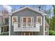 Exterior elevation featuring a grey shingle and a second-story balcony with a white railing at 4655 Jett Rd, Atlanta, GA 30327