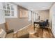 Neutral home office featuring a dark desk, modern chair, hardwood floors, and built-in storage at 4655 Jett Rd, Atlanta, GA 30327